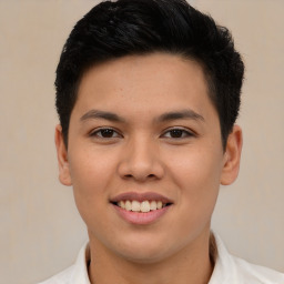 Joyful latino young-adult male with short  brown hair and brown eyes