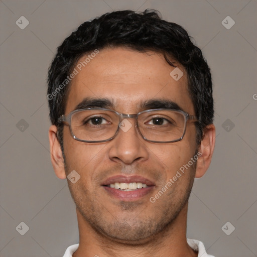 Joyful white young-adult male with short  black hair and brown eyes