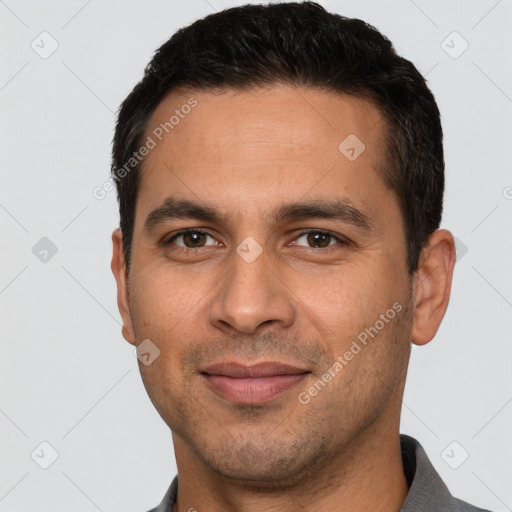 Joyful white young-adult male with short  black hair and brown eyes