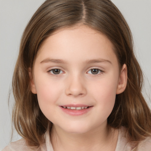 Joyful white child female with medium  brown hair and brown eyes