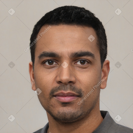 Neutral latino young-adult male with short  black hair and brown eyes