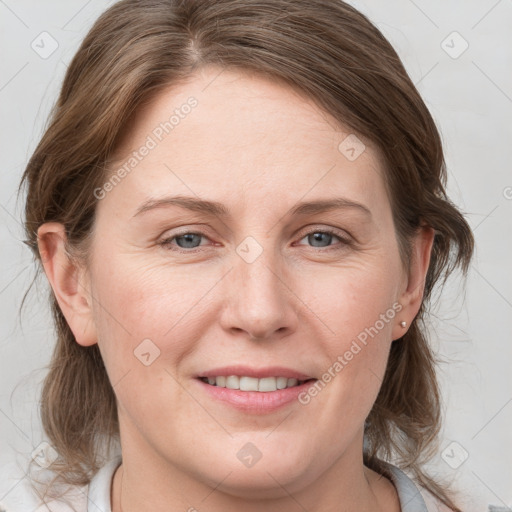 Joyful white adult female with medium  brown hair and grey eyes