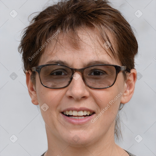 Joyful white adult female with short  brown hair and brown eyes