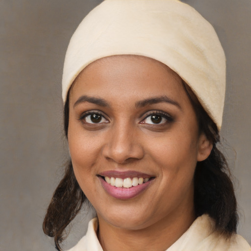 Joyful white young-adult female with medium  black hair and brown eyes