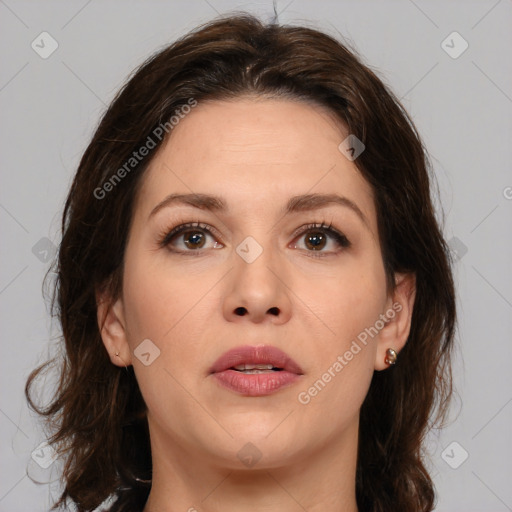 Joyful white adult female with medium  brown hair and brown eyes