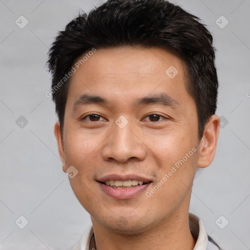 Joyful white young-adult male with short  black hair and brown eyes