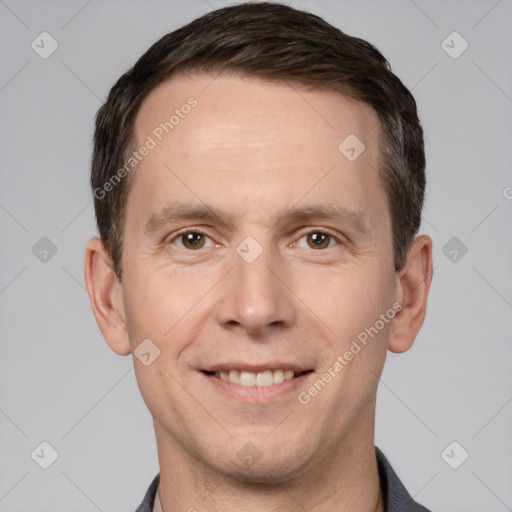 Joyful white adult male with short  brown hair and brown eyes