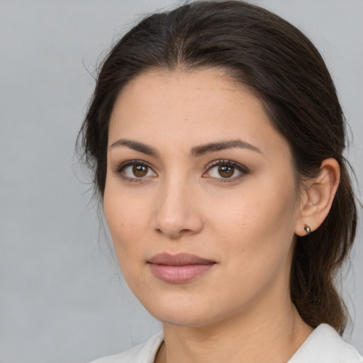 Joyful white young-adult female with medium  brown hair and brown eyes