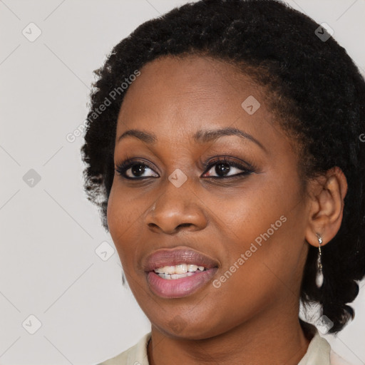 Joyful black young-adult female with medium  black hair and brown eyes