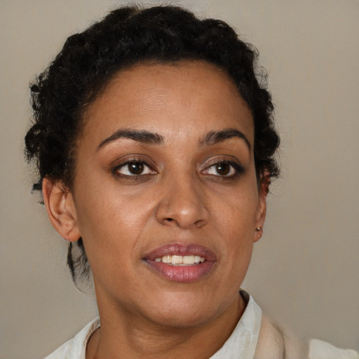 Joyful latino adult female with short  brown hair and brown eyes