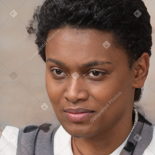 Joyful black young-adult male with short  brown hair and brown eyes