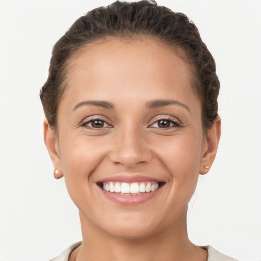 Joyful white young-adult female with short  brown hair and brown eyes