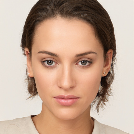 Neutral white young-adult female with medium  brown hair and brown eyes