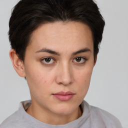 Neutral white young-adult female with short  brown hair and brown eyes