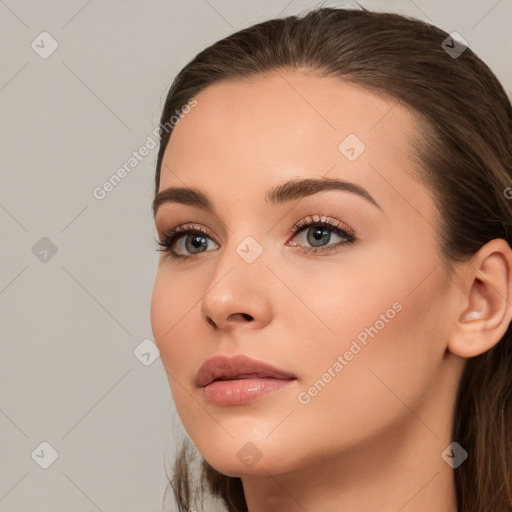 Neutral white young-adult female with long  brown hair and brown eyes