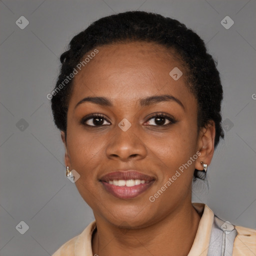 Joyful black young-adult female with short  black hair and brown eyes