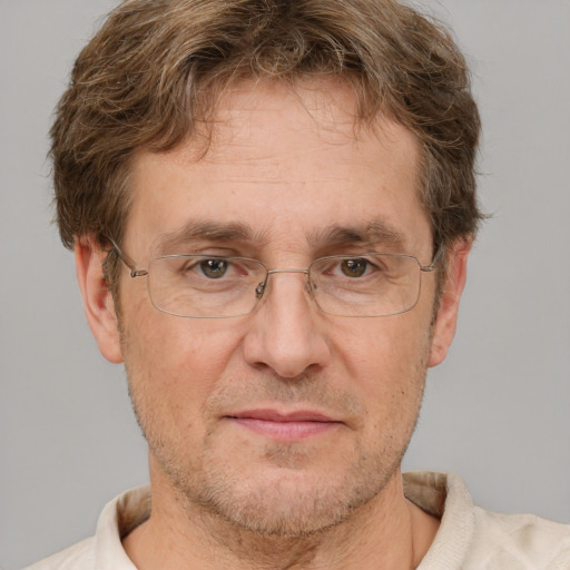 Joyful white middle-aged male with short  brown hair and brown eyes