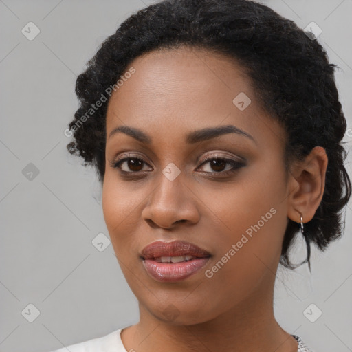 Joyful black young-adult female with medium  black hair and brown eyes