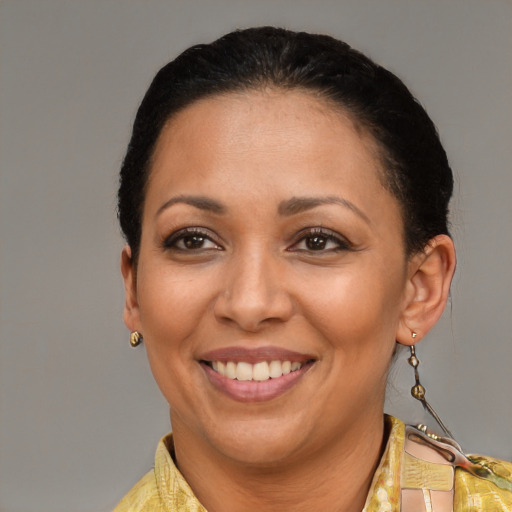 Joyful latino adult female with short  brown hair and brown eyes