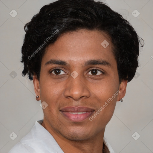Joyful white young-adult male with short  black hair and brown eyes
