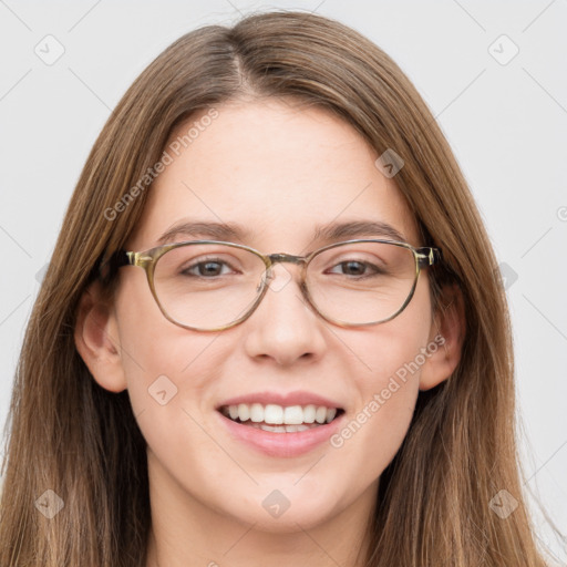 Joyful white young-adult female with long  brown hair and green eyes