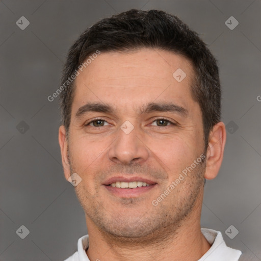 Joyful white young-adult male with short  brown hair and brown eyes