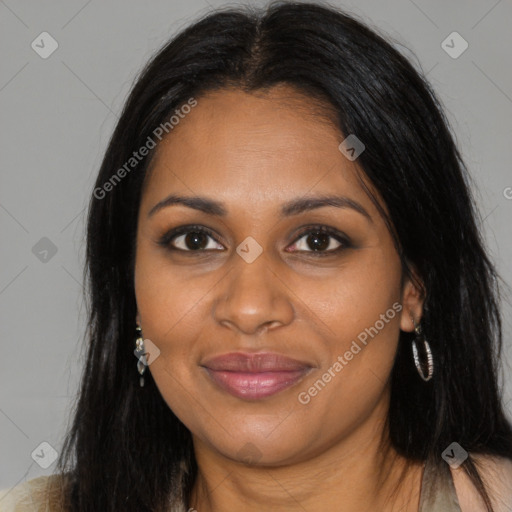 Joyful black young-adult female with long  brown hair and brown eyes