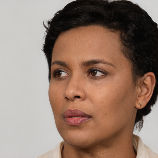 Neutral latino young-adult female with short  black hair and brown eyes