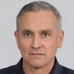 Neutral white middle-aged male with short  gray hair and brown eyes