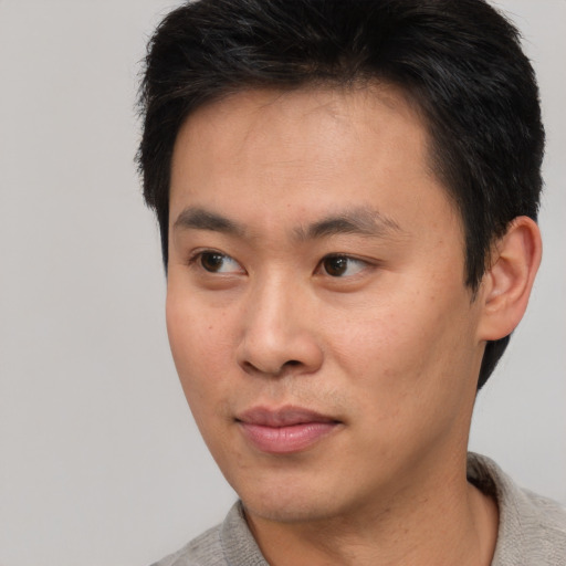 Neutral asian young-adult male with short  brown hair and brown eyes
