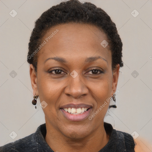 Joyful black adult female with short  brown hair and brown eyes