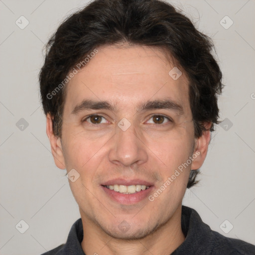 Joyful white adult male with short  brown hair and grey eyes