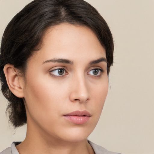 Neutral white young-adult female with medium  brown hair and brown eyes