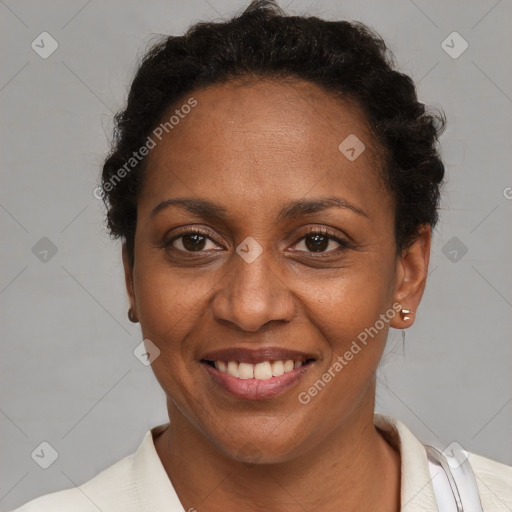 Joyful black adult female with short  brown hair and brown eyes