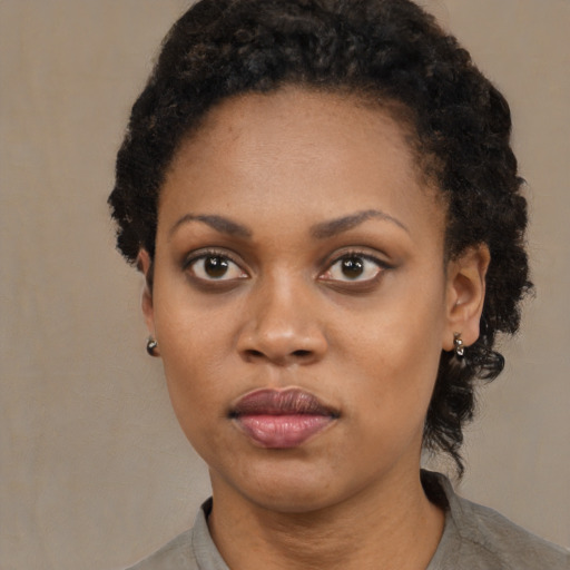 Neutral black young-adult female with medium  black hair and brown eyes