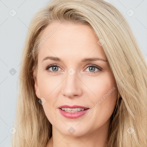 Joyful white young-adult female with long  brown hair and blue eyes