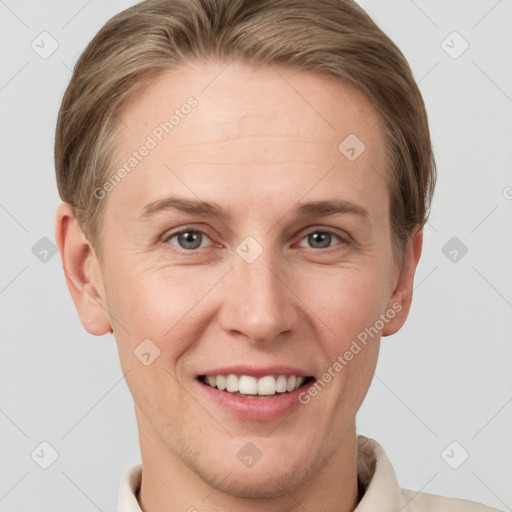 Joyful white adult female with short  brown hair and grey eyes