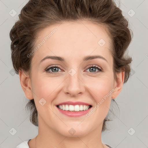 Joyful white young-adult female with medium  brown hair and green eyes