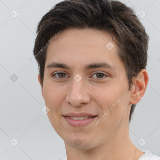 Joyful white young-adult female with short  brown hair and brown eyes