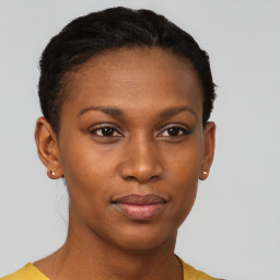 Joyful black young-adult female with short  brown hair and brown eyes