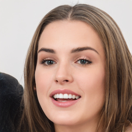 Joyful white young-adult female with long  brown hair and grey eyes