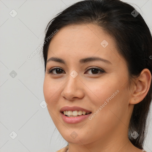 Joyful asian young-adult female with long  brown hair and brown eyes