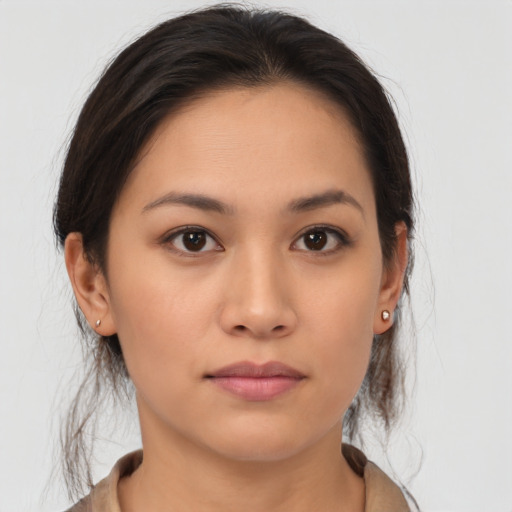 Neutral asian young-adult female with medium  brown hair and brown eyes