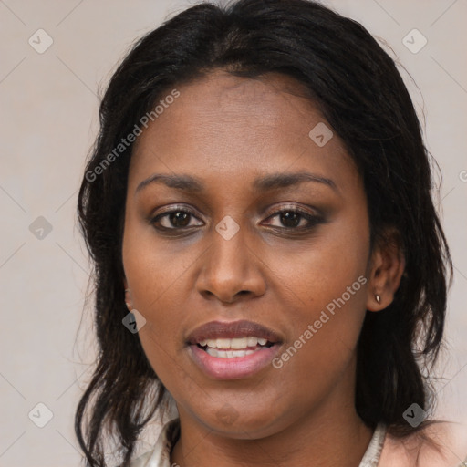 Joyful black young-adult female with long  brown hair and brown eyes