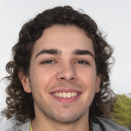 Joyful white young-adult male with medium  brown hair and brown eyes