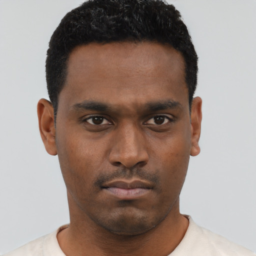 Neutral black young-adult male with short  black hair and brown eyes