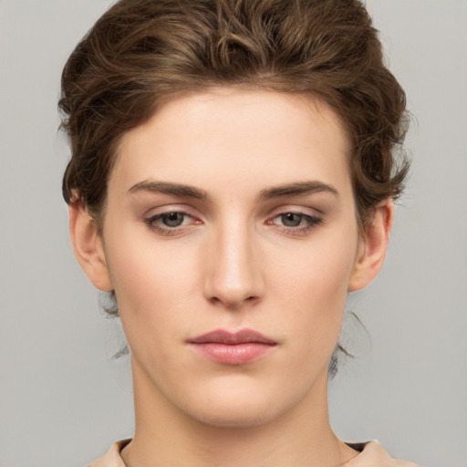 Neutral white young-adult female with short  brown hair and brown eyes