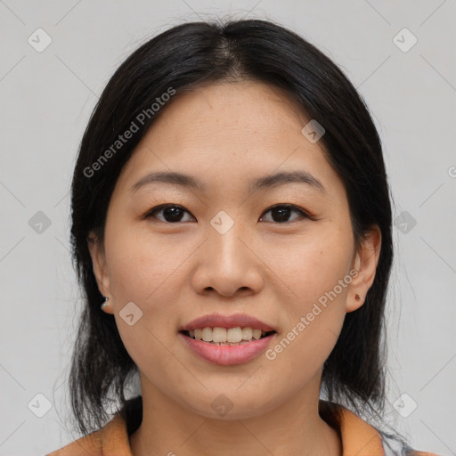 Joyful asian young-adult female with medium  black hair and brown eyes