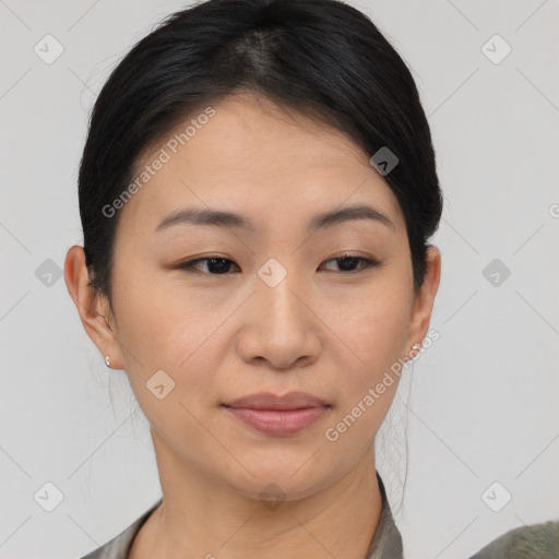 Joyful asian young-adult female with medium  black hair and brown eyes