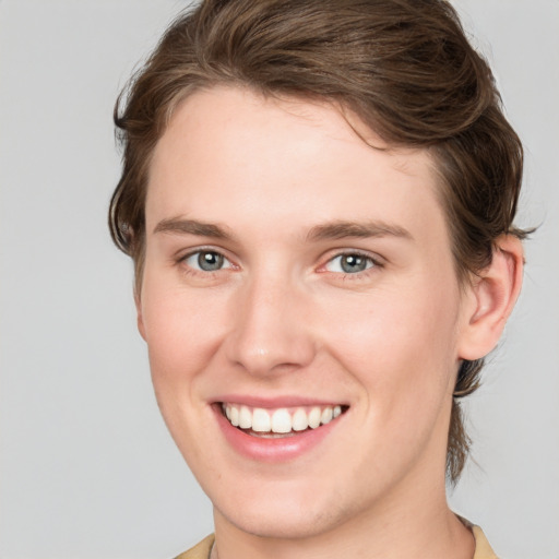 Joyful white young-adult female with medium  brown hair and blue eyes